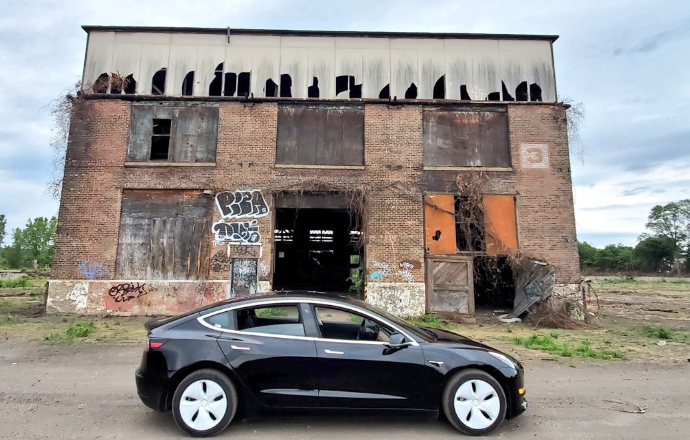 PHOTO Tesla Parked Out In Front Of Abandoned Building Looks Futuristic