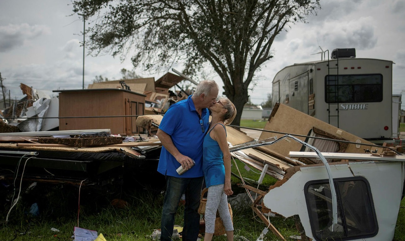 PHOTO Couple Kisses As They Return Home To Find 40 Foot Camping Trailer Destroyed By Hurricane