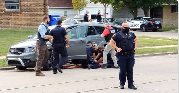 PHOTO Jacob Blake Holding Knife As Officers Surround Him