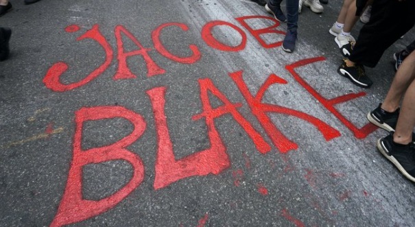 PHOTO Jacob Blake Written In Red Grafitti On Wisconsin Sidewalk