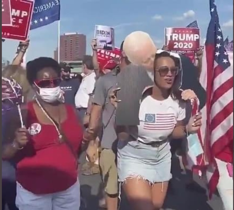 PHOTO Joe Biden Kissing A Woman Sign