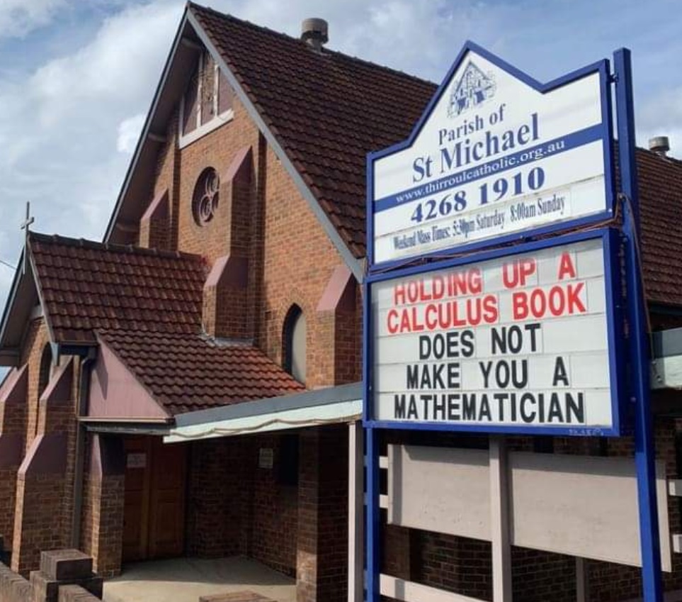 PHOTO Parish Of St Michael Church Sign Says Holding Up A Calculus Book Does Not Make You A Mathematician