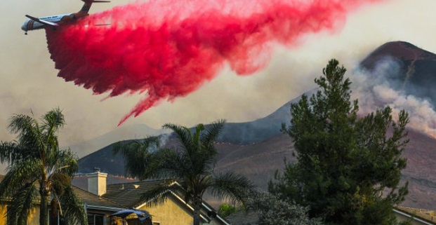 PHOTO Chino Hills Home Getting Doused With Bright Red Fire Retardant