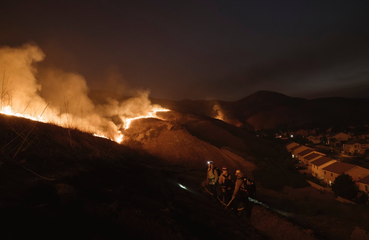 PHOTO Firefighters Working In The Middle Of The Night In Pitch Dark To Keep Flames On Hill Away From Houses Below