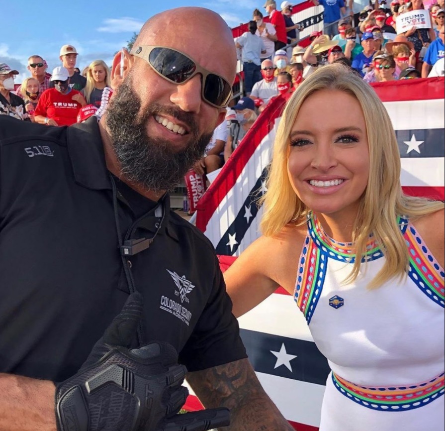 PHOTO Kayleigh McEnany With Dude Who Looks Like Bounty Hunter At Trump Rally Today