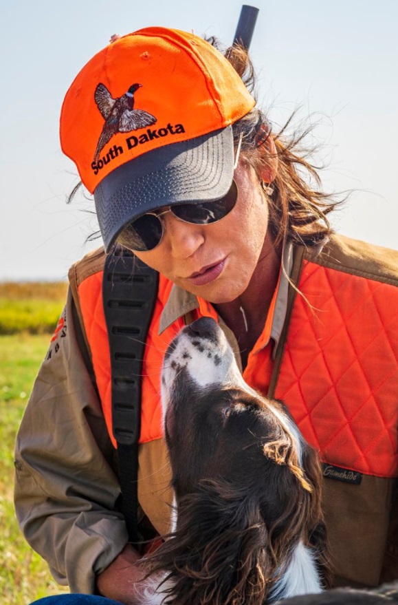 PHOTO Kristi Noem Kissing A Dog With An Orange South Dakota Hat On