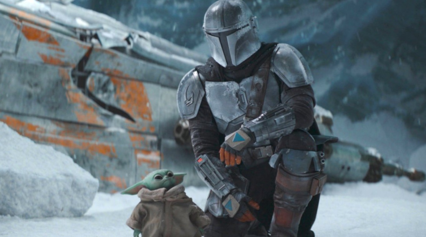 PHOTO The Mandalorian Kneeling Down To See Baby Yoda