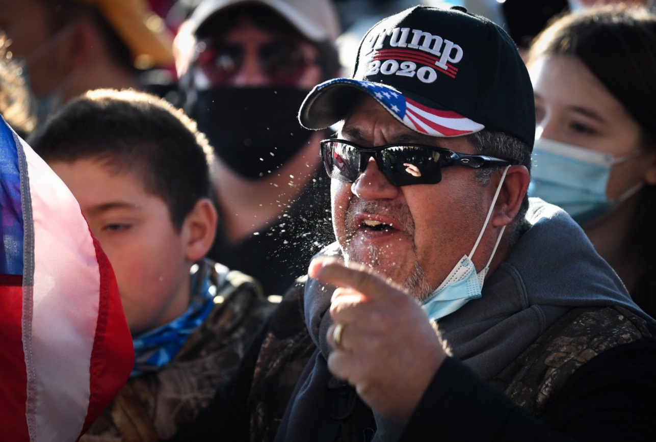 PHOTO Trump Supporter With 2020 Campaign Hat Sneezing All Over People At Rally