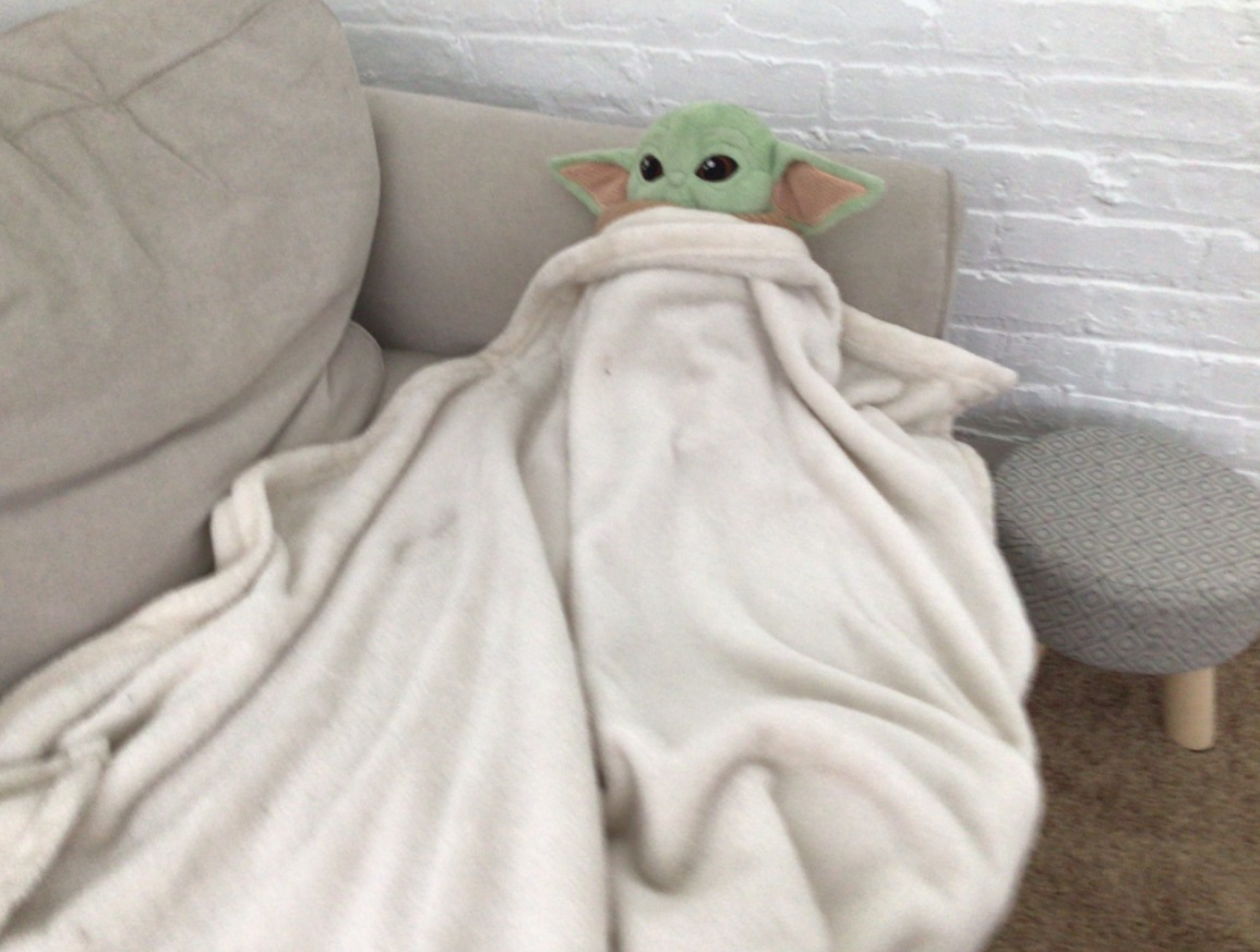 PHOTO Baby Yoda Sleeping On The Couch Under A Blanket