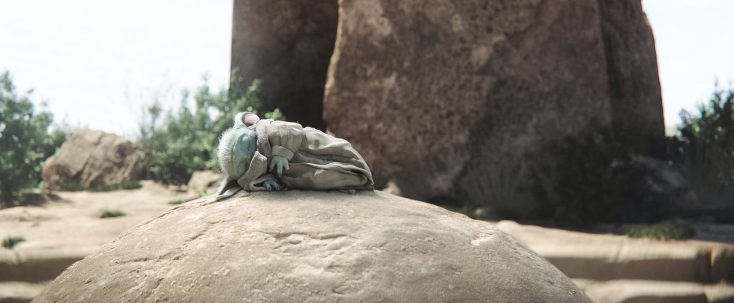 PHOTO Baby Yoda Sound Asleep On A Rock In The Middle Of The Desert