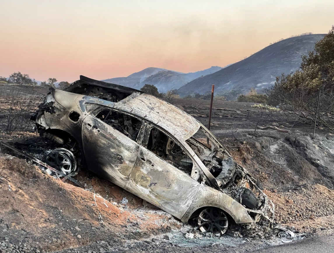 PHOTO Car Completely Burned Out In Orange County From Bond Fire