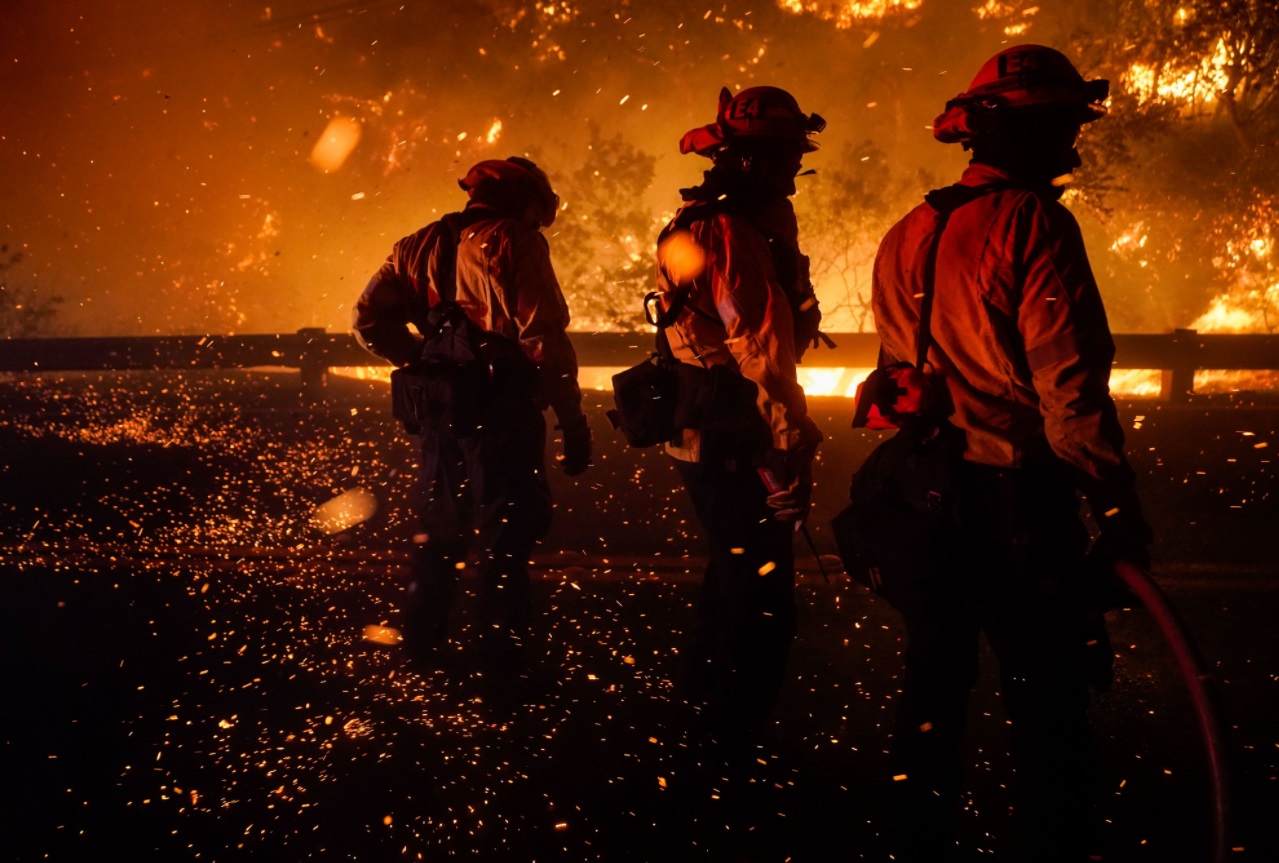 PHOTO Firefighters Look Helpless Surrounded By Flames From Bond Fire