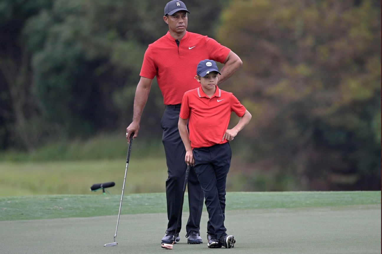 PHOTO Tiger Woods' Son Looking Just Like Him Scouting Out A Hole On The Golf Course