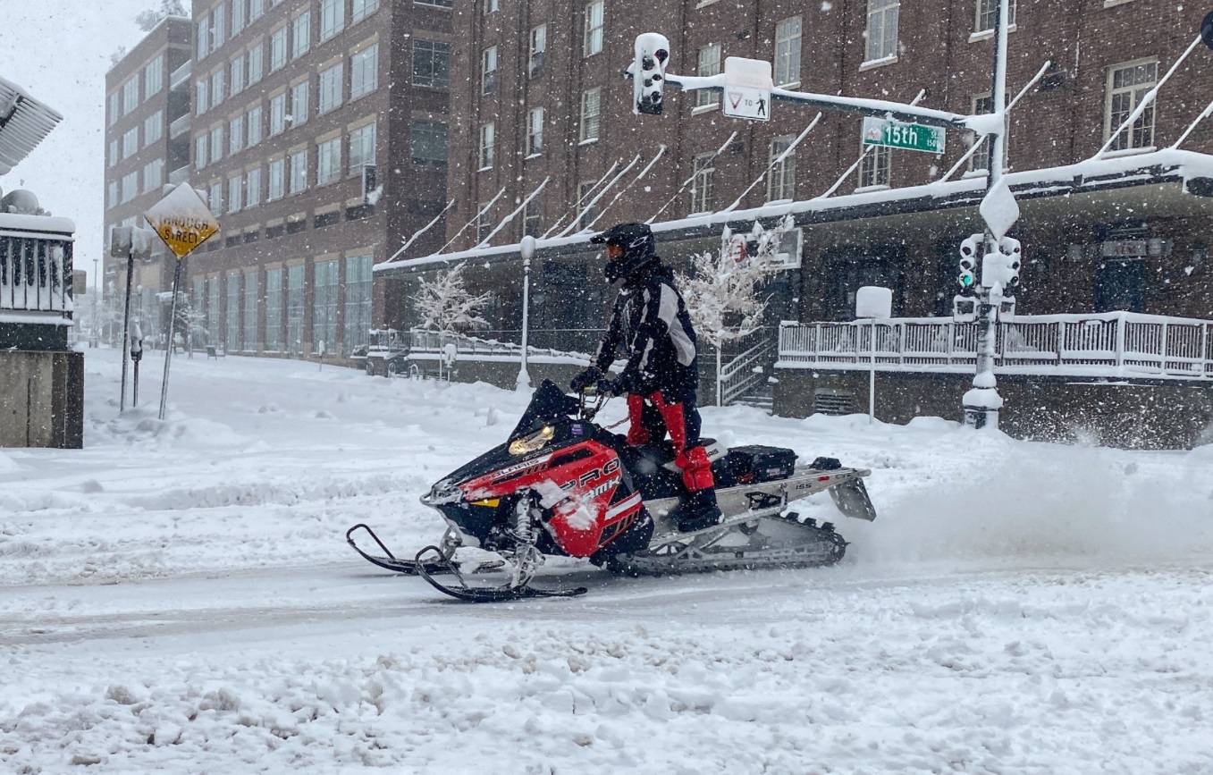 PHOTO Dude Riding Snowmobile Through Downtown Denver Sunday Afternoon