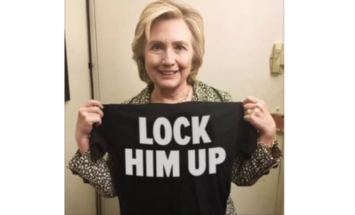 PHOTO Hillary Clinton Holding A Lock Him Up T-Shirt