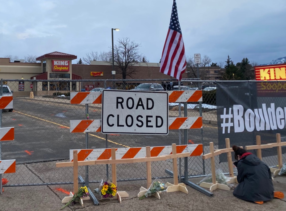 PHOTO King Sooper Grocery Store Blocked Off By Barricade As Flowers Are Left