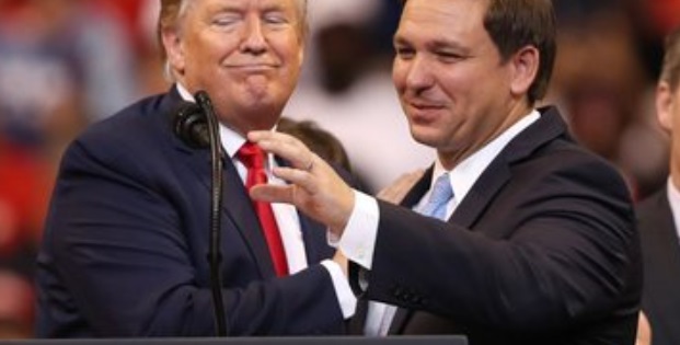 PHOTO Ron DeSantis Stealing The Mic From Donald Trump