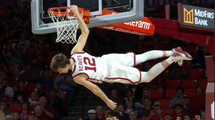 PHOTO Austin Reaves Hanging On The Rim Sideways