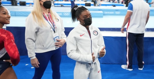 PHOTO Simone Biles Giving Her Teammates Thumbs Up As She Sits Out Events