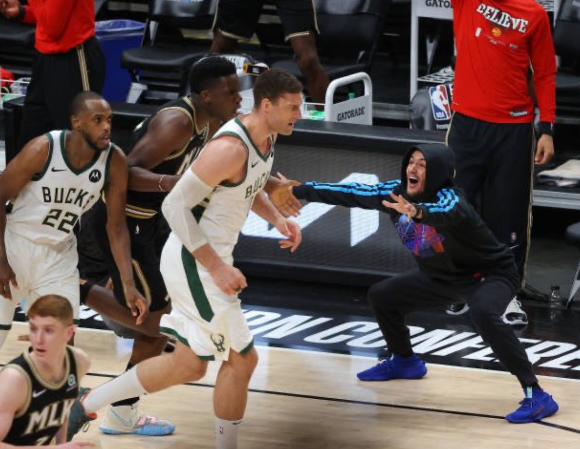 PHOTO Trae Young Pretending To Hug Clint Capela From Sideline