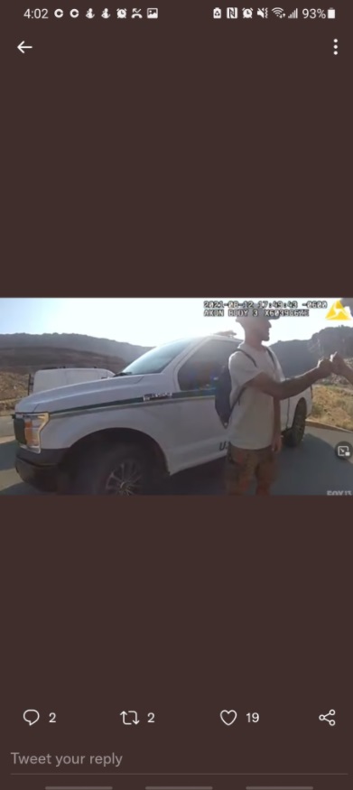 PHOTO Brian Laundrie Fist Bumping Moab Utah Police Officer