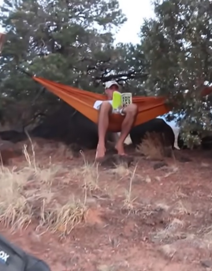 PHOTO Brian Laundrie Reading Book About Missing Women While Sitting In A Hammock At National Park