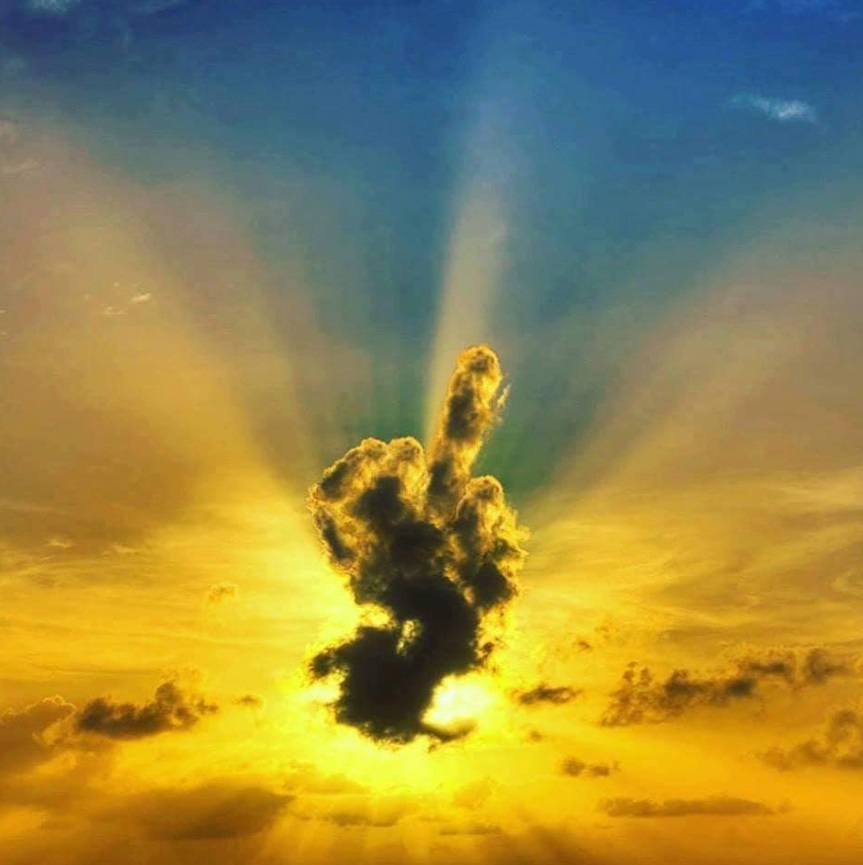 PHOTO Cloud In The Sky Making The Shape Of Someone Giving The Middle Finger At Sunset