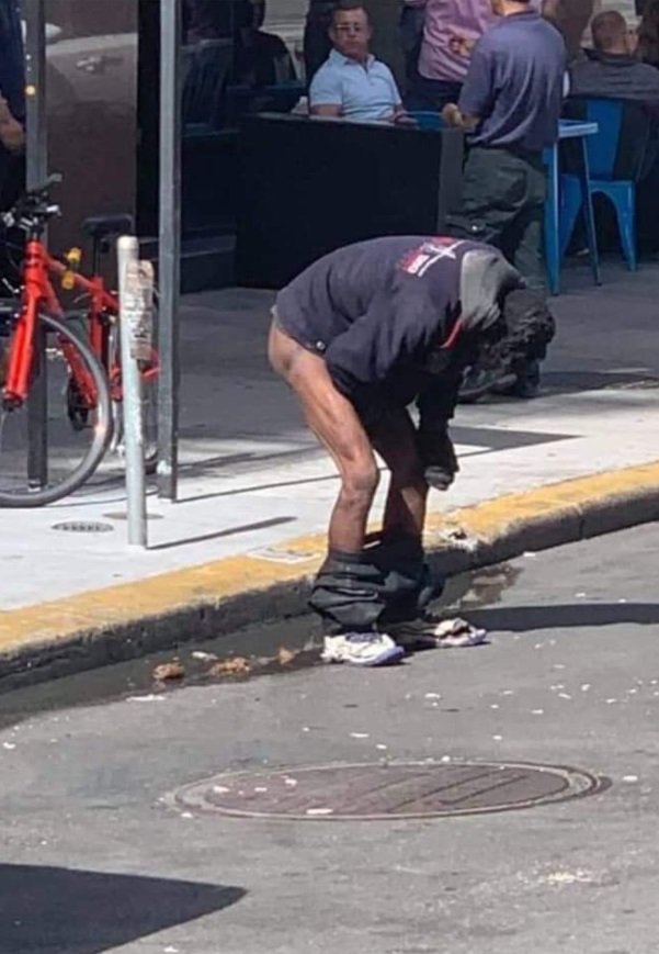 PHOTO Homeless Dude Taking A Sh*t On The Streets Of San Francisco Near Fancy Restaurant