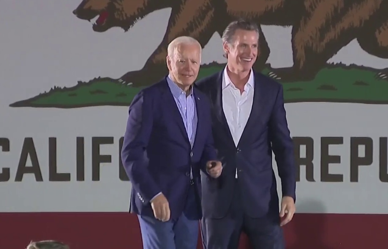 PHOTO Joe Biden And Gavin Newsom Holding Hands On Stage
