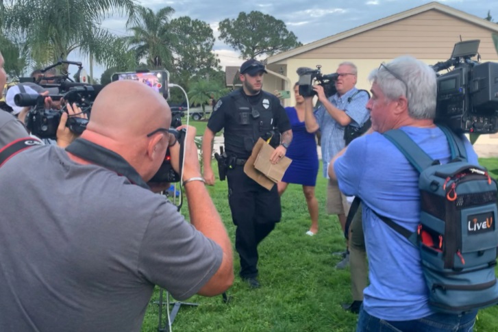 PHOTO Police Carrying Evidence Out Of Brian Laundrie's Parents House