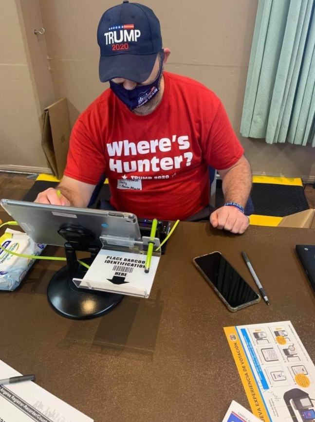 PHOTO Poll Worker In West Hollywood Wearing A Wear's Hunter Shirt With Trump 2020 Hat