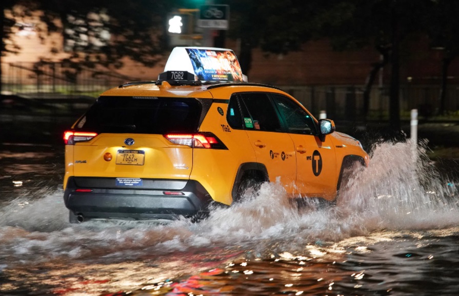 PHOTO Taxi Driving Through Streets Of New York That Was Flooded