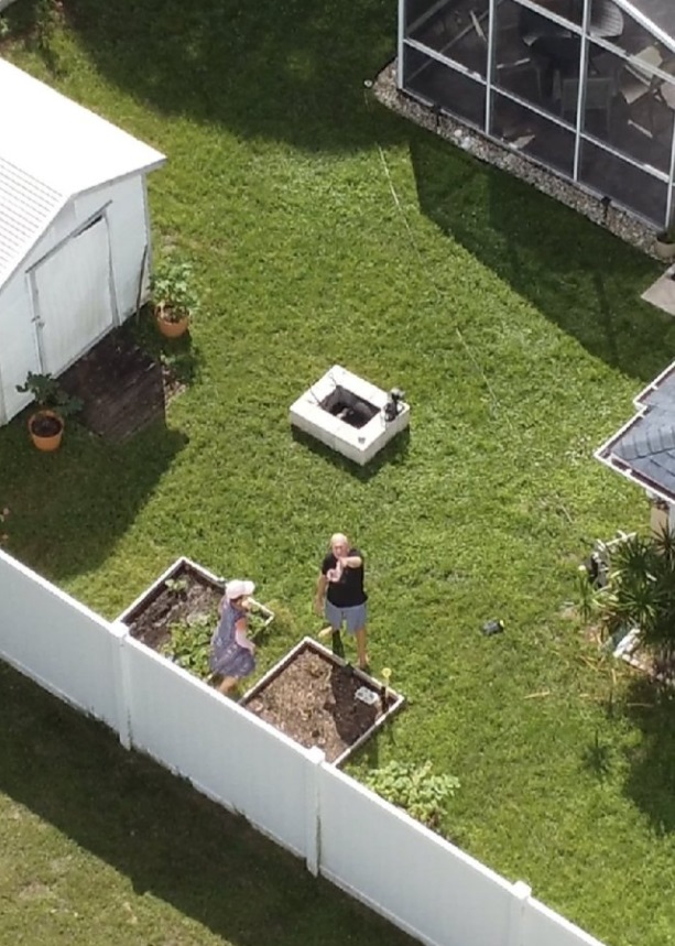 PHOTO Brian Laundrie's Parents Burying Evidence In The Backyard While Police Helicopter Flies Over