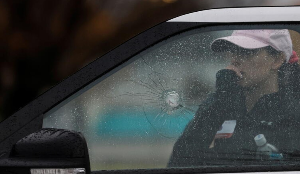 PHOTO Close Up Of Shattered Glass From Jacob Bergquist Shooting Rifle Into Police Vehicle's Window