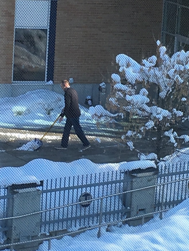 PHOTO Fired Coach Matt Wells Shoveling Snow Outside Football Stadium