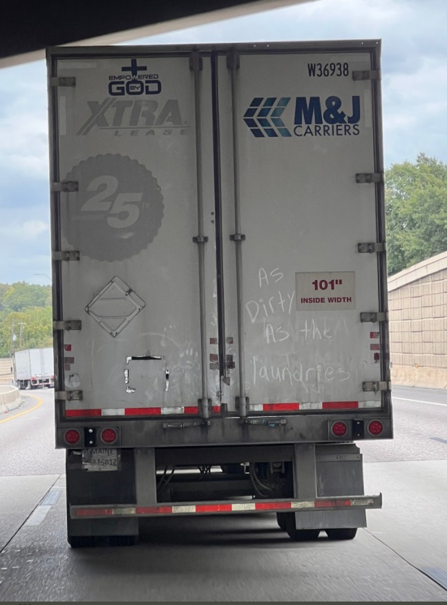 PHOTO Semi-Truck Had As Dirty As The Laundries Written On The Back While Driving I-30 in Dallas TX