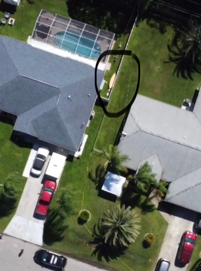 PHOTO Surfboard and Kayak Being Stored On The Side Of Brian Laundrie's Parents House