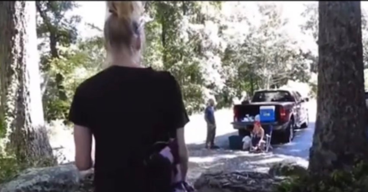 PHOTO Zoomed Out View Of Brian Laundrie Talking To Camper Next To Her Truck While Brian's Hands Are In His Pockets