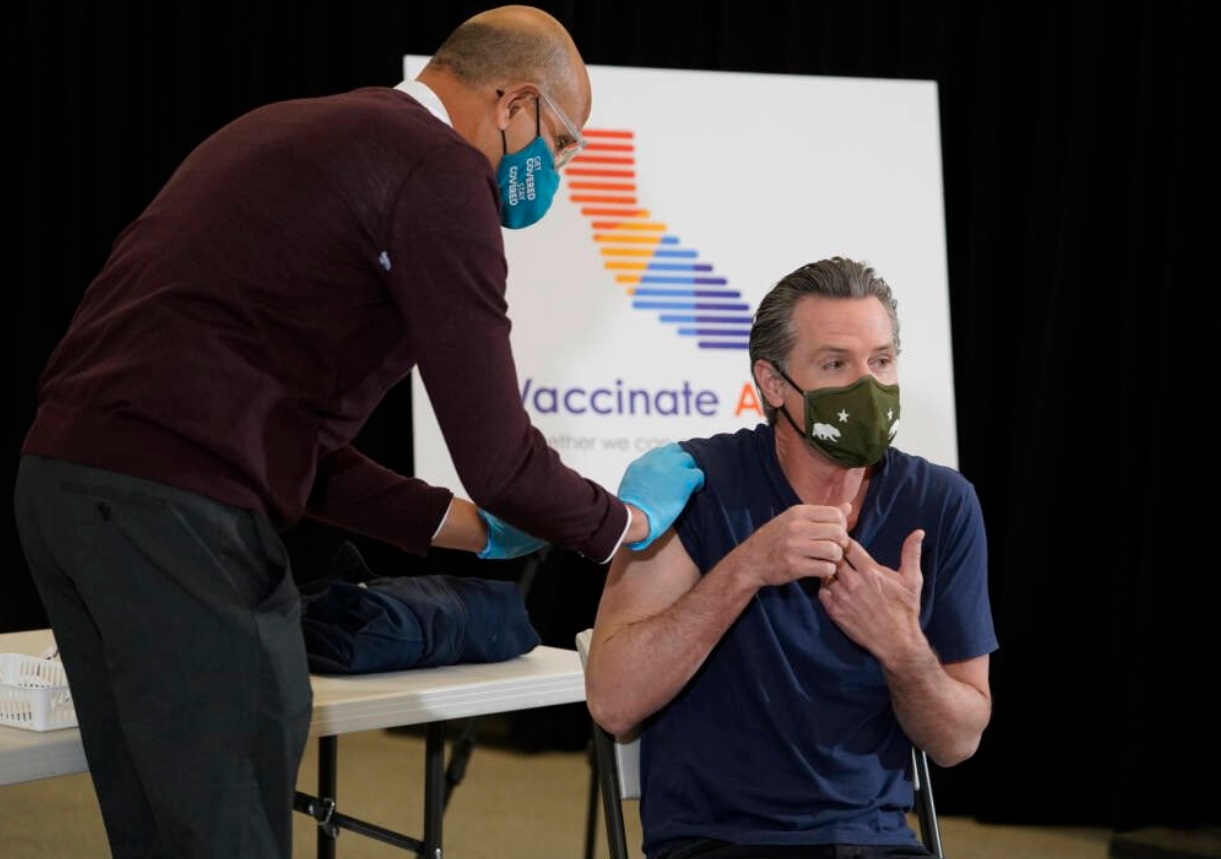 PHOTO Gavin Newsom Looking Nervous While Doctor Puts Band Aid On Arm After Getting Booster Shot