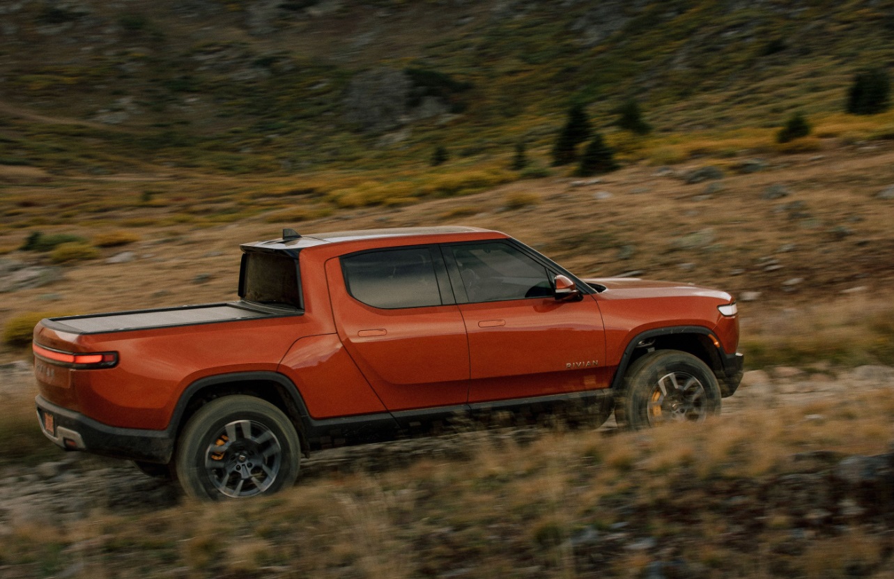 PHOTO Of Rivian Electric Truck Driving Off Road In The Dirt