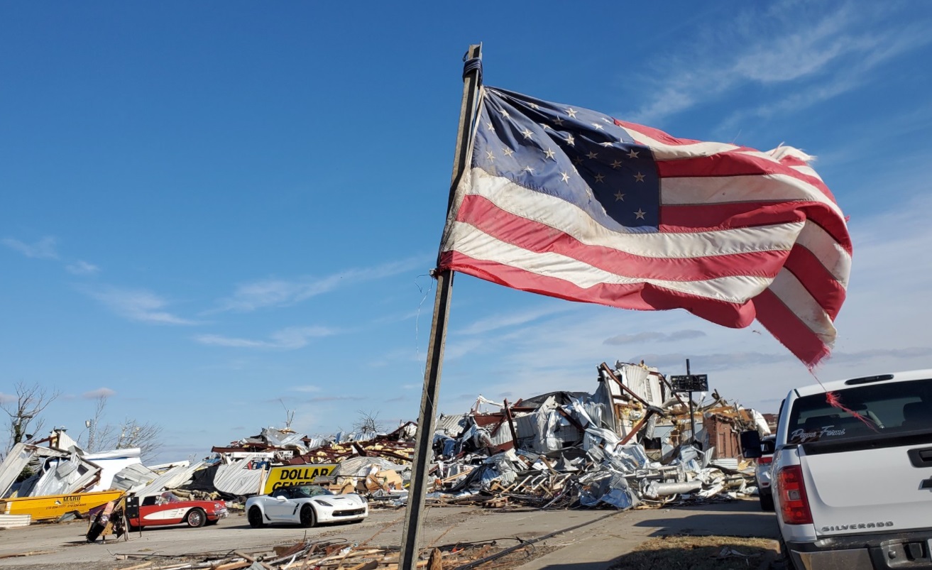 PHOTO American Flag Planted Amongst The Disaster In Mayfield Kentucky
