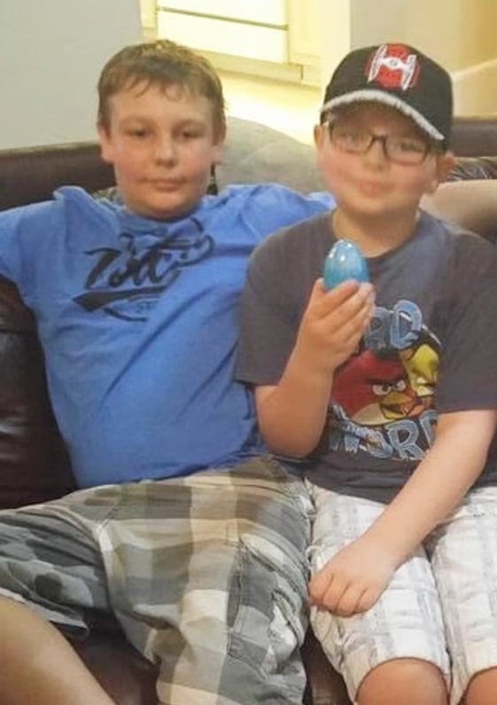 PHOTO Ethan Crumbley Holding A Plastic Easter Egg With His Half Brother