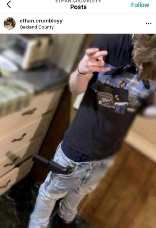 PHOTO Ethan Crumbley Throwing Up Forks While Storing Loaded Gun In His Pocket