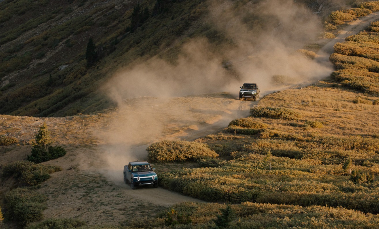 PHOTO Rivian Electric Truck Looking Sick Kicking Up Dirt Off-Road