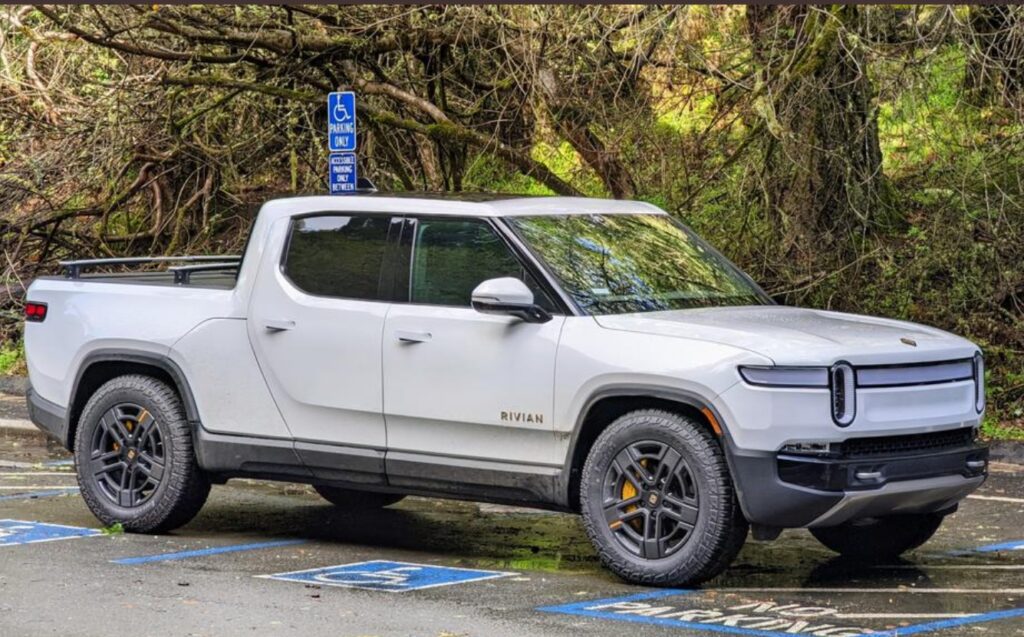 PHOTO Rivian Truck Taking Up All The Handicap Spots By Parking Over All ...