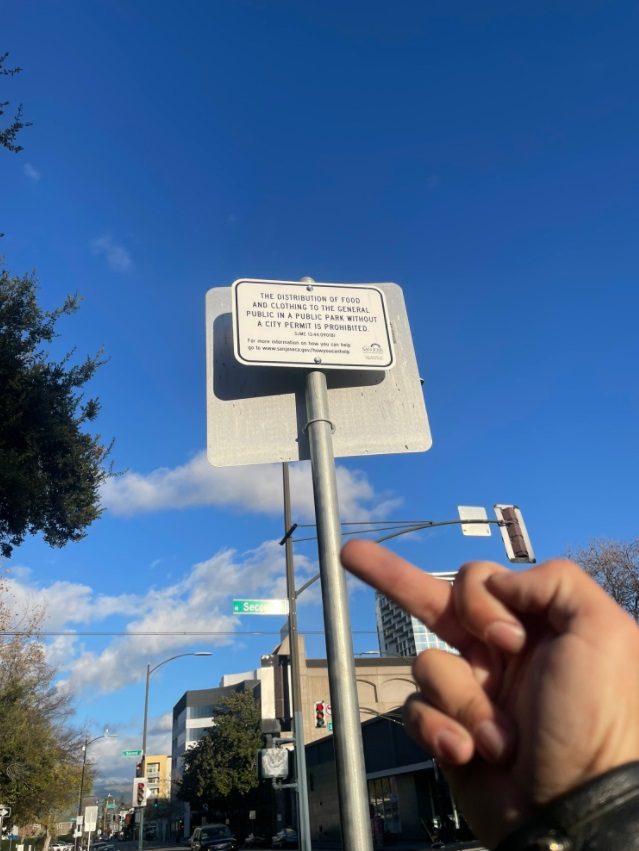 PHOTO The Distrubtion Of Food And Clothing To The General Public In A Public Park Without A City Permit Sign In San Jose California