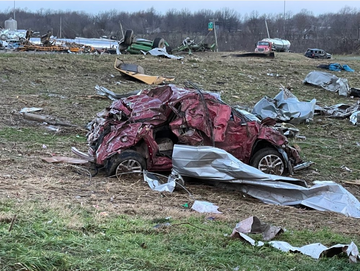 PHOTO Tornado Hit Mayfield Kentucky So Hard One Car Is Just Slaps Of Scrap Metal Smashed Together In Grassy Field