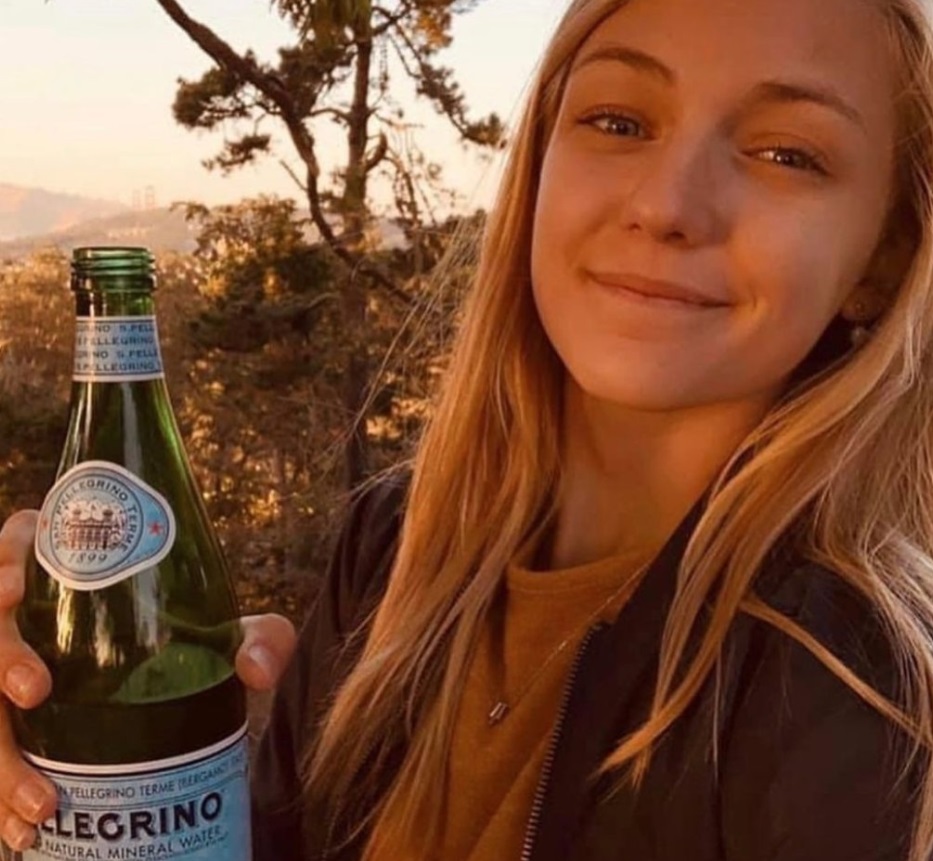 PHOTO Gabby Petito Drinking Sparkling Water On The Beach