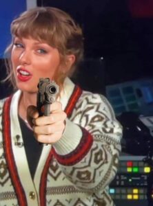 PHOTO Taylor Swift Holding A Loaded Gun Meme
