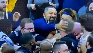 PHOTO Juwan Howard Rubbing Wisconsin Assistant Coaches Head With His Hand Still Shot